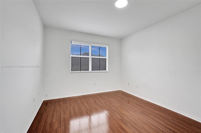 spare room with hardwood / wood-style floors