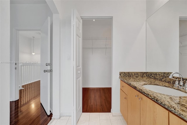 bathroom featuring wood-type flooring and vanity