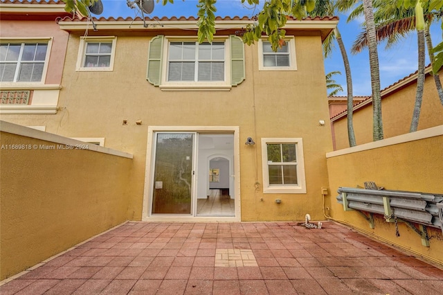 back of house with a patio area