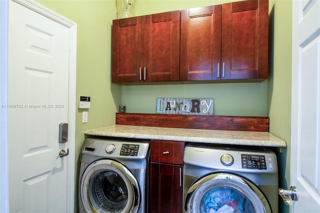 laundry room with cabinets and independent washer and dryer