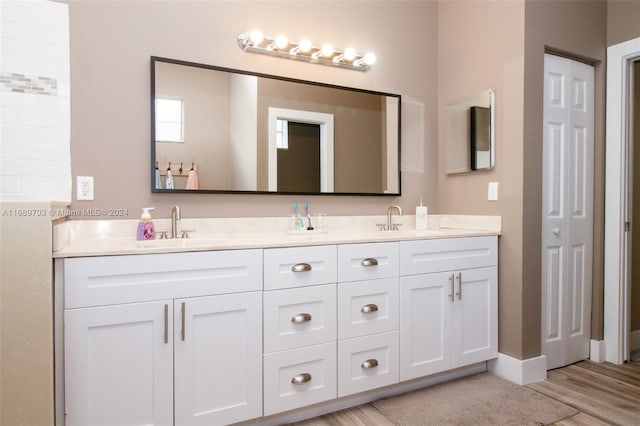 bathroom featuring vanity and hardwood / wood-style flooring