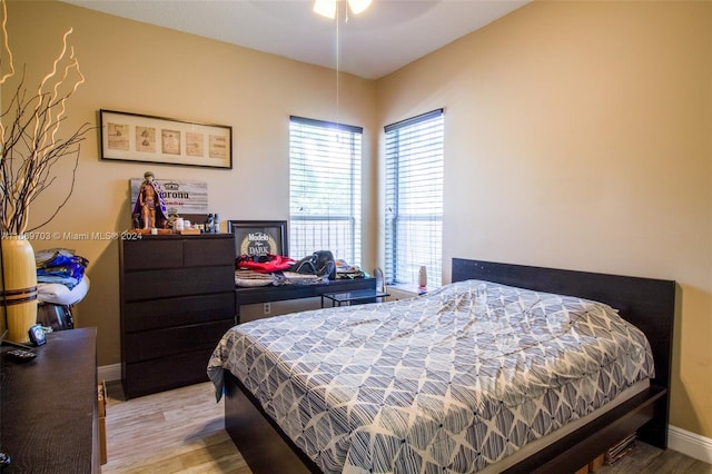 bedroom with light hardwood / wood-style flooring