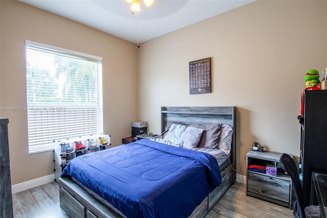 bedroom featuring ceiling fan and light wood-type flooring