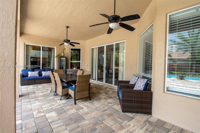 view of patio / terrace featuring ceiling fan and outdoor lounge area