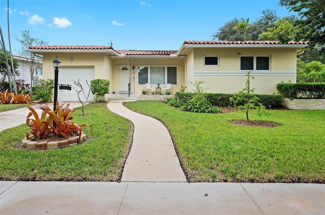 mediterranean / spanish-style home featuring a garage and a front lawn