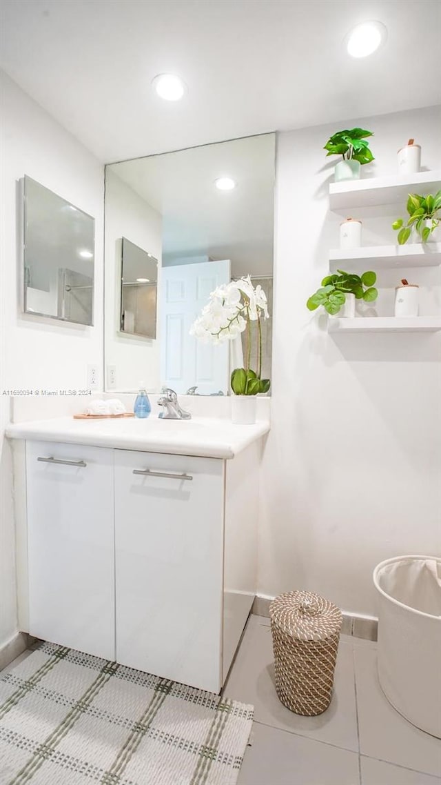 bathroom featuring tile patterned flooring and vanity