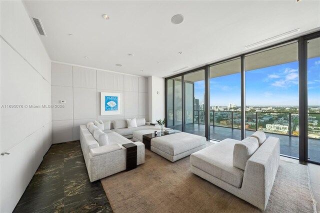 living room with floor to ceiling windows