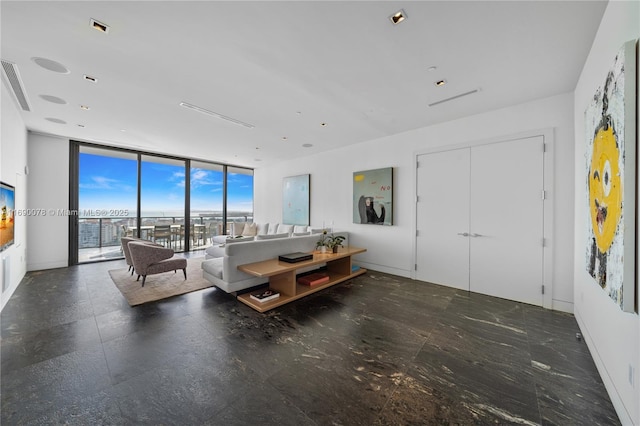 living room with a wall of windows