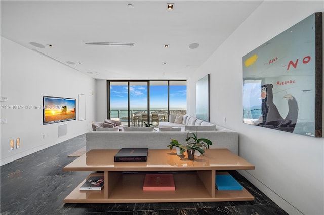 living room with floor to ceiling windows