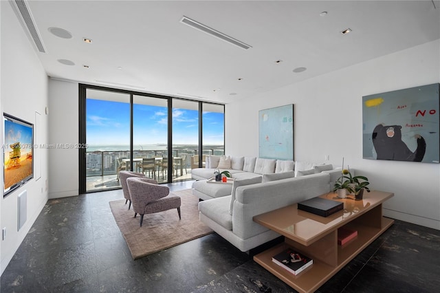 living room featuring a wall of windows