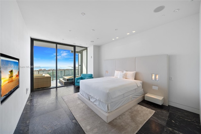 bedroom featuring floor to ceiling windows and access to outside