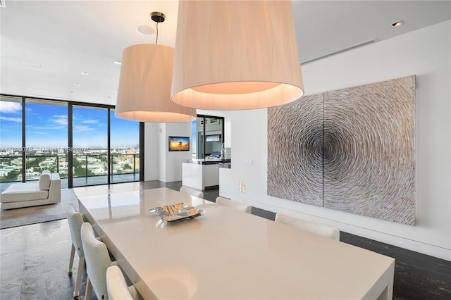 dining space with floor to ceiling windows