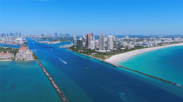 aerial view featuring a view of the beach and a water view