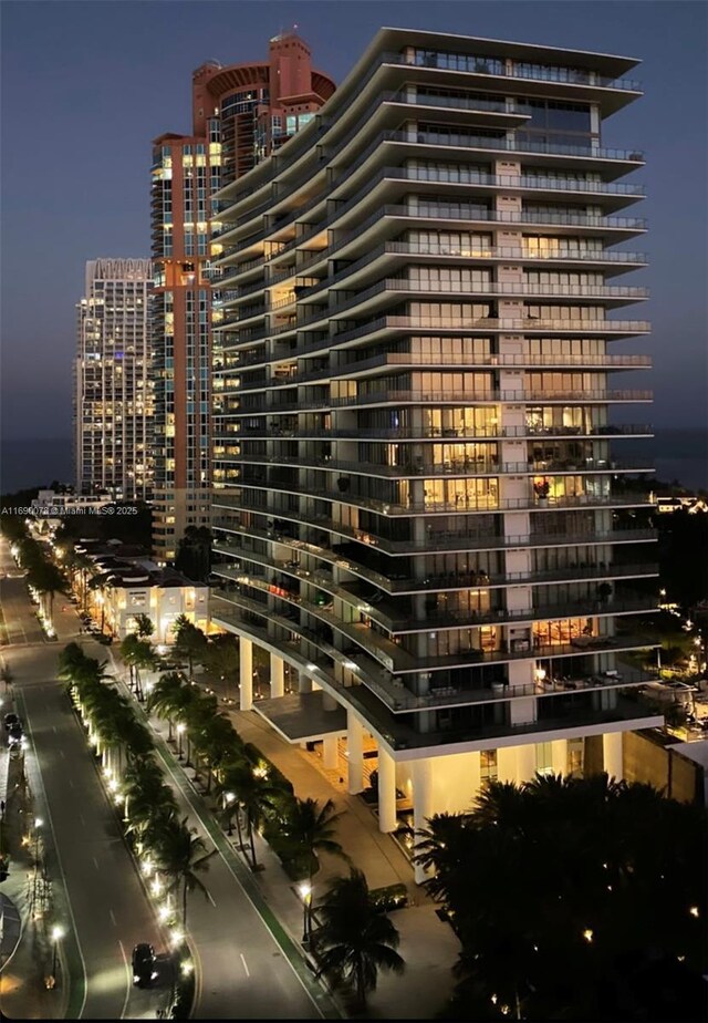 view of outdoor building at dusk