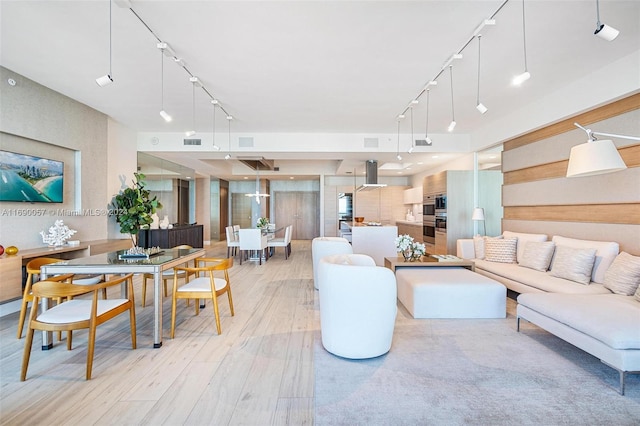 living room with light hardwood / wood-style flooring