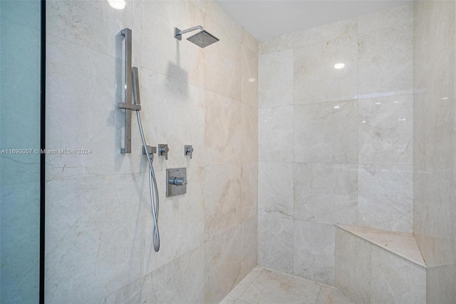 bathroom with tiled shower