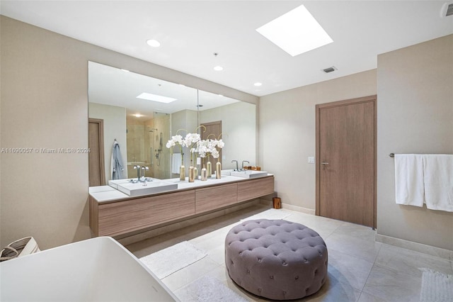 bathroom featuring vanity, plus walk in shower, tile patterned floors, a skylight, and a chandelier