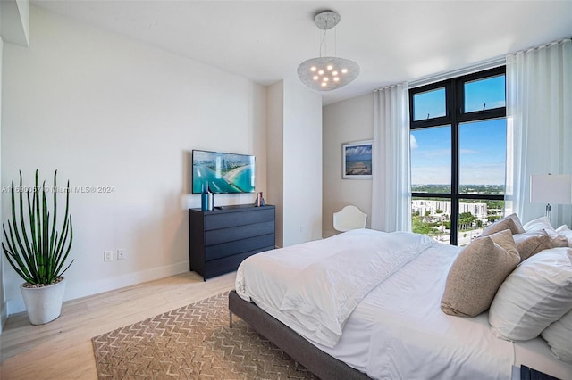 bedroom with hardwood / wood-style flooring