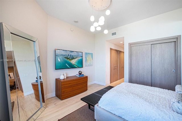 bedroom with light wood-type flooring