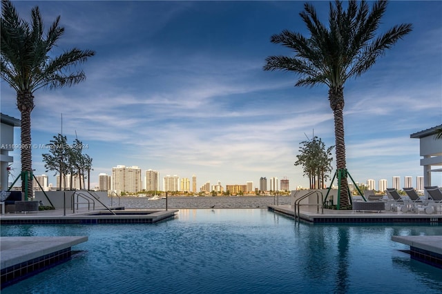 view of pool with a water view