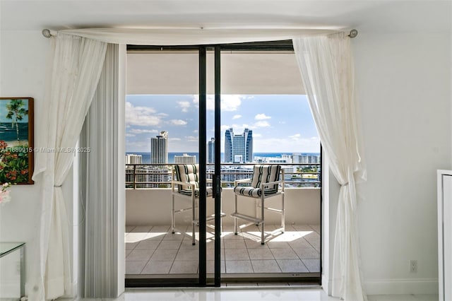 2500 Parkview Dr Unit 2303, Hallandale Beach, FL 33009 - entryway with tile patterned floors, a view of city, and baseboards