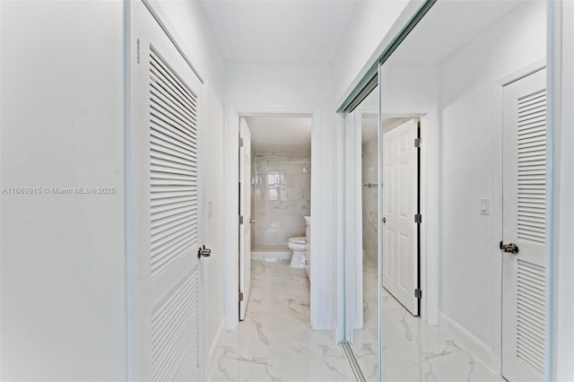 2500 Parkview Dr Unit 2303, Hallandale Beach, FL 33009 - bathroom with toilet, a closet, baseboards, and marble finish floor