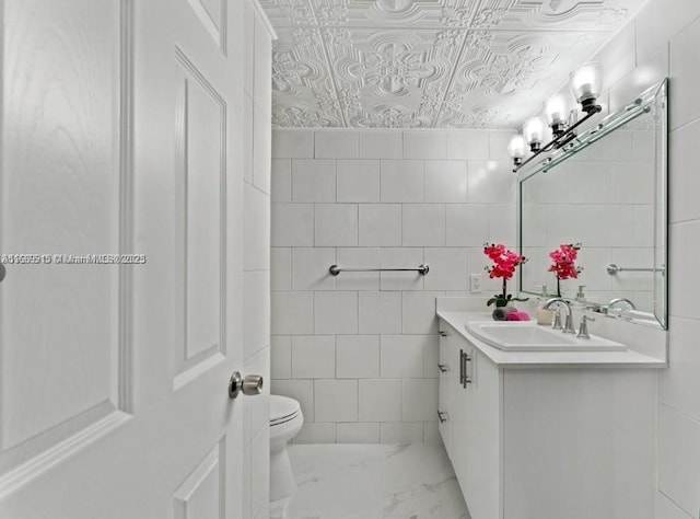 2500 Parkview Dr Unit 2303, Hallandale Beach, FL 33009 - bathroom with toilet, tile walls, an ornate ceiling, marble finish floor, and vanity