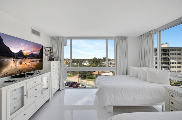 tiled bedroom with multiple windows