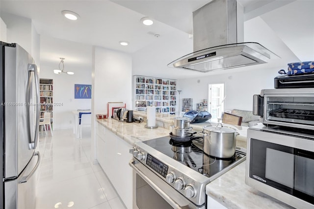 kitchen featuring stainless steel appliances, light tile patterned flooring, white cabinetry, light stone counters, and island range hood