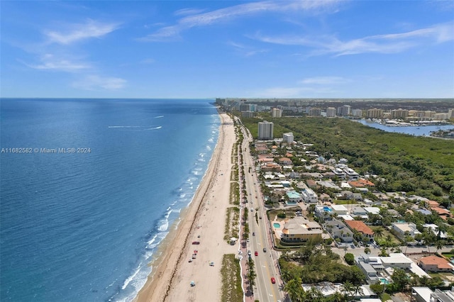 drone / aerial view featuring a view of the beach and a water view