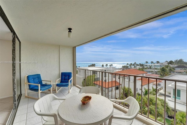 balcony featuring a water view