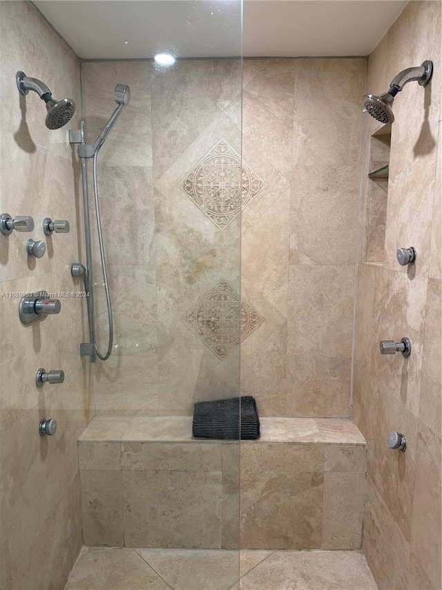 bathroom with a tile shower