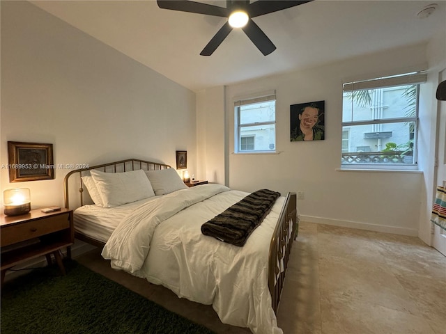 bedroom featuring ceiling fan and vaulted ceiling