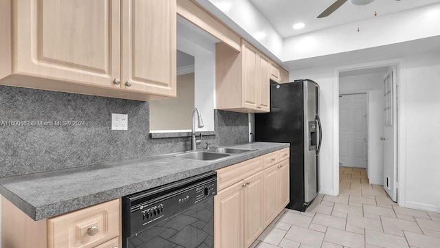 kitchen with dishwasher, light brown cabinetry, and sink