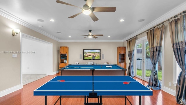 rec room with hardwood / wood-style flooring, plenty of natural light, ornamental molding, and french doors