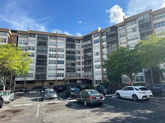 1100 Saint Charles Pl Unit 203, Pembroke Pines, FL 33026 - view of apartment building / complex with uncovered parking