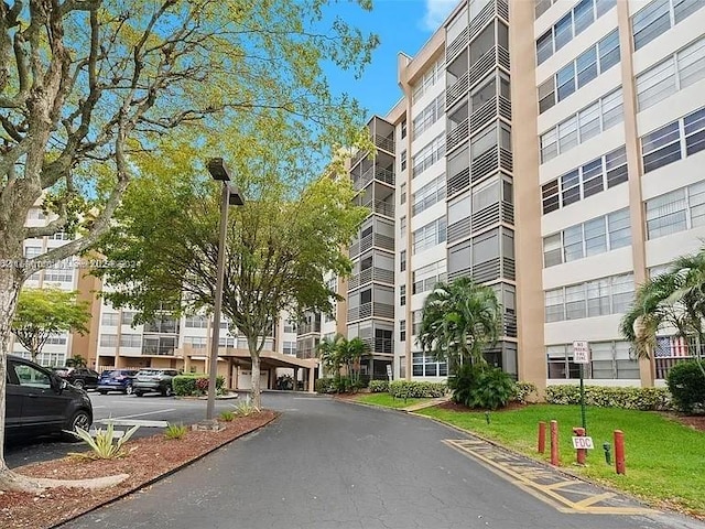 1100 Saint Charles Pl Unit 203, Pembroke Pines, FL 33026 - view of apartment building / complex featuring uncovered parking