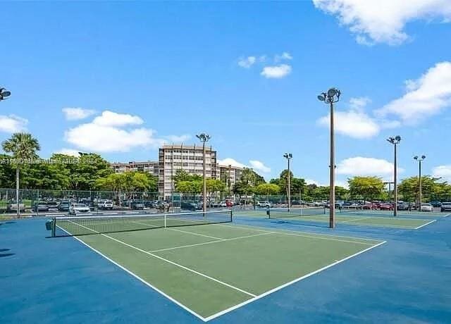 1100 Saint Charles Pl Unit 203, Pembroke Pines, FL 33026 - view of tennis court featuring fence