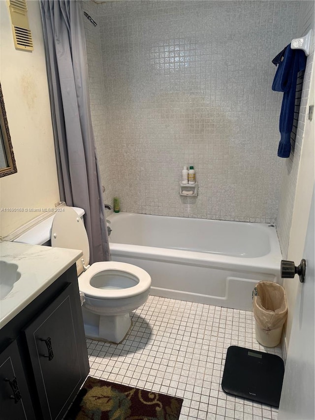 full bathroom featuring vanity, tile patterned flooring, toilet, and shower / bath combination with curtain