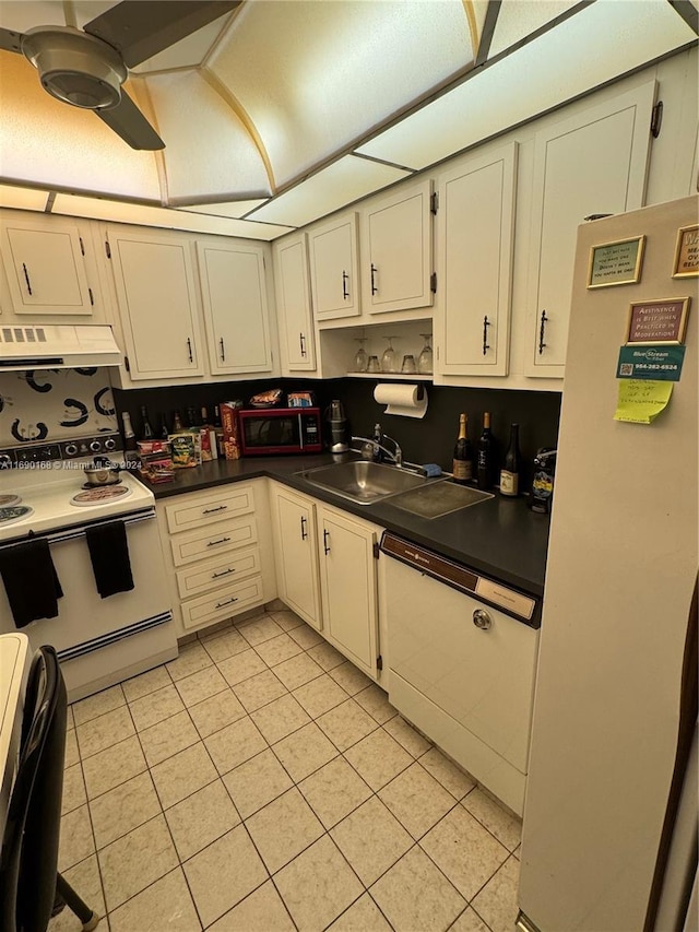 kitchen with range hood, light tile patterned floors, sink, white cabinetry, and white appliances