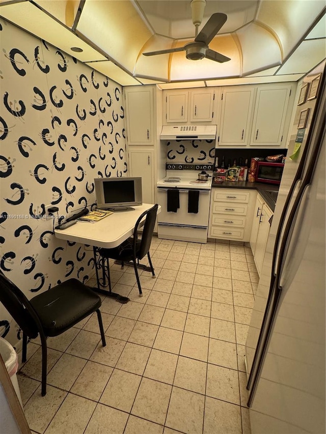 kitchen with ceiling fan, stainless steel refrigerator, light tile patterned floors, and white range with electric cooktop