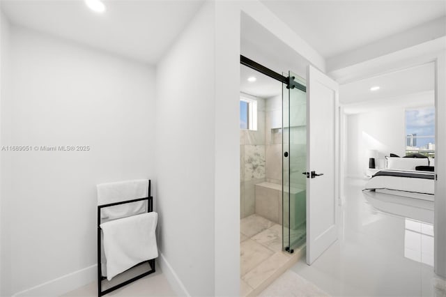 bathroom featuring baseboards, a stall shower, ensuite bath, and recessed lighting