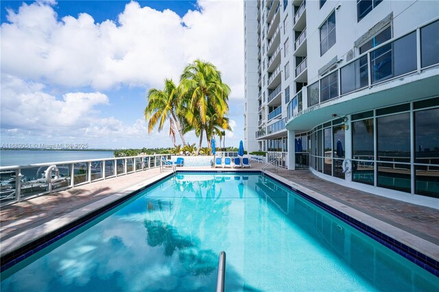 community pool featuring a water view