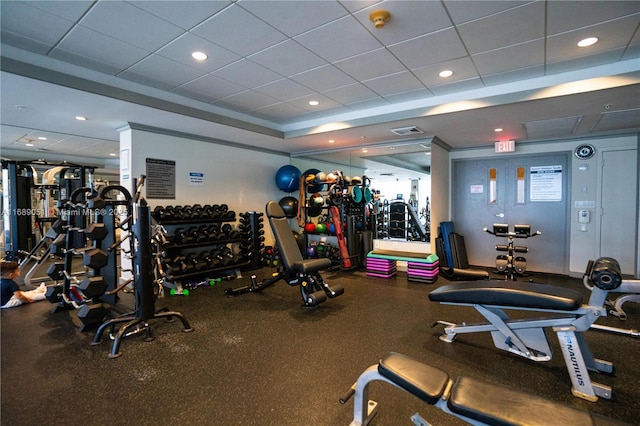 gym with visible vents, a paneled ceiling, and recessed lighting