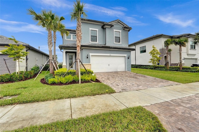 view of front property with a garage and a front yard