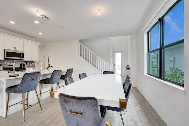 dining room featuring light hardwood / wood-style floors