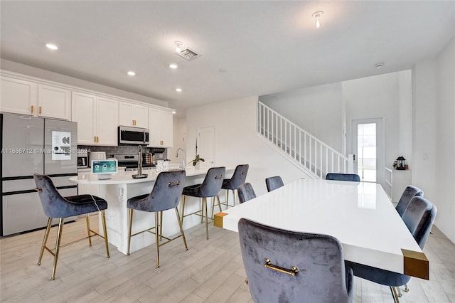 dining room featuring light hardwood / wood-style floors