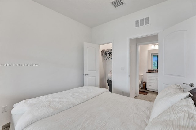 bedroom featuring connected bathroom