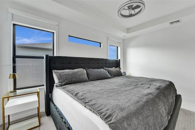 bedroom featuring light carpet