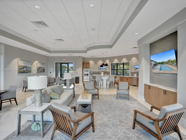 living room with a raised ceiling